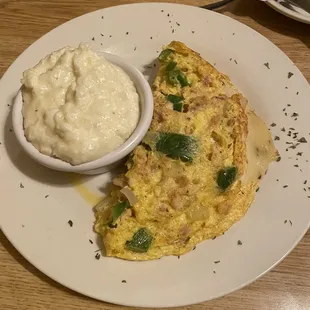 Salmon, fried onions, and green peppers omelette, a special order with house grits... I ate every drop!