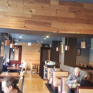 Layout of the restaurant and customers enjoying lunch hour