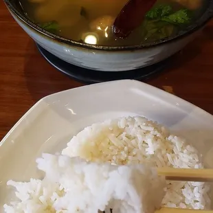 A side of white rice  goes well with the broth