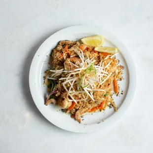 Pad Thai - rice noodles stir fried with chicken, shirmp, egg, and veggies, in an authentic tamarind sauce.
