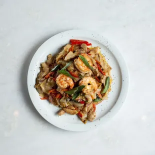 Drunken Noodles - fresh rice noodles sauteed with chicken, shrimp, egg, and veggies. House garlic soy sauce made from scratch with no msg.