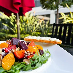 Organic Beet Salad paired with herb ricotta cheese and citrus dressing.