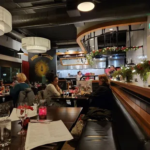 a group of people eating at a restaurant