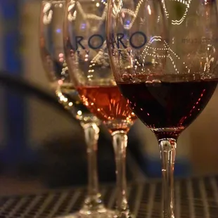 three glasses of wine on a table