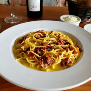 Spaghetti Carbonara : Our most famous pasta dish, prepared with eggs, bacon, Parmesan cheese and a touch of cream for smoothness.