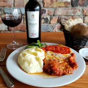 Chicken Parmigiana Served with spaghetti or with our delicious homemade mashed potatoes and a glass of Amarone Graal.