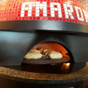 Baking our Amarone house bread in our brick oven.