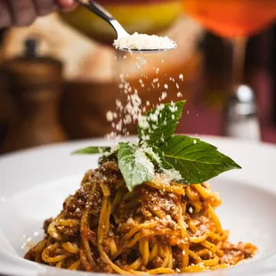 Spaghetti Bolognese: Classic Bolognese sauce, simmered to perfection and served over fresh