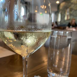 A glass of Lubanzi Chenin Blanc from South Africa.