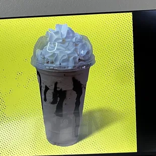 a milkshake with whipped cream on top