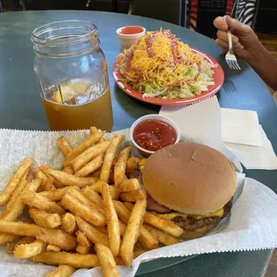 Burger, fries and club salad. Angle shot of salad which is actually much larger than picture shows
