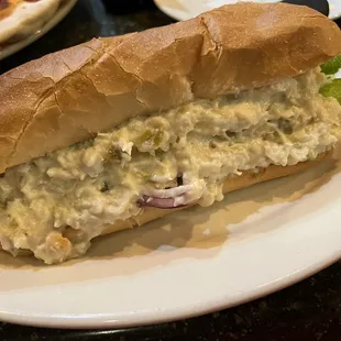Chicken salad on a toasted bun.