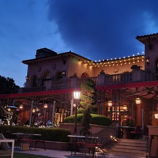 a couple dining outside at night