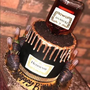 a bottle of honey on top of a cake