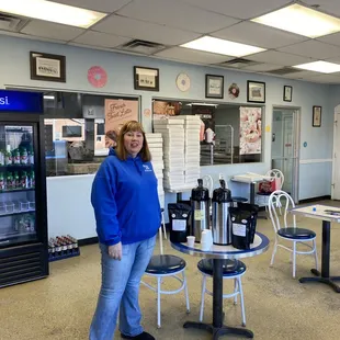 a woman standing in a restaurant