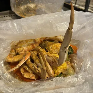 Dungeness crab with potato, corn, and a side of broccoli (broccoli is additional)