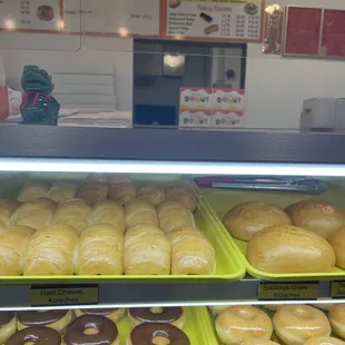 a variety of doughnuts in a display case