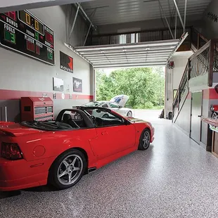 a red sports car in a garage