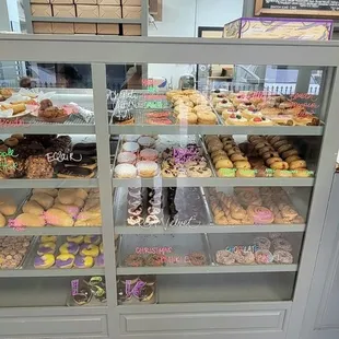 a man standing in front of a bakery