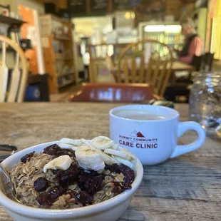 Yogurt and granola and bananas.