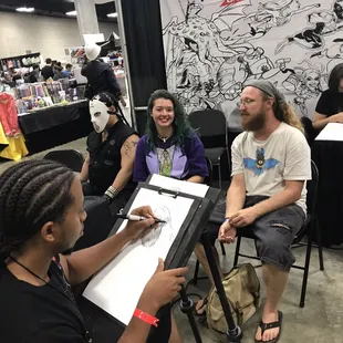 Artists working on live drawings!