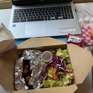 Orange chicken, green salad with yummy dressing, rice, Thai Iced Tea.
