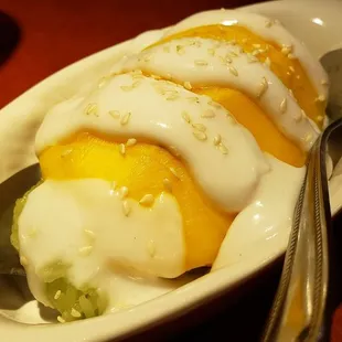 Mango sticky rice (&amp;12.75), vegan by default. Delicious. Warm rice, excellent coconut cream and ripe mango.