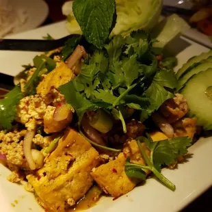 Laab salad ($16.75), made vegan. Spicy and savory and delicious. Served with warm sticky rice on the side.