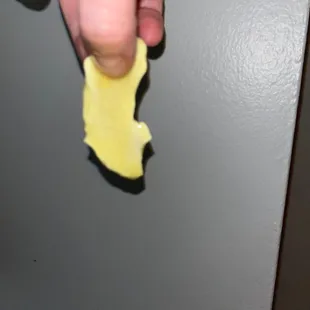 a person holding a piece of food