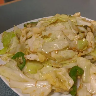 a plate of cabbage and chicken