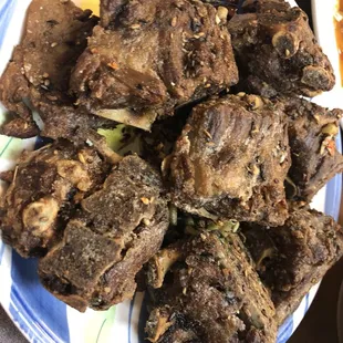 a plate of cooked meat on a table