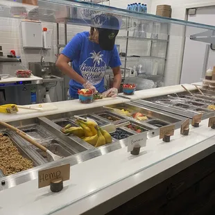 Our açaí bowl in the making. She really did a great job! It was sooo delicious!