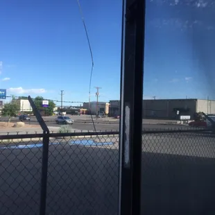 This shows the busy street through the cracked window.