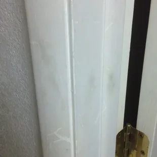 Dirt marks all over the walls and doorways