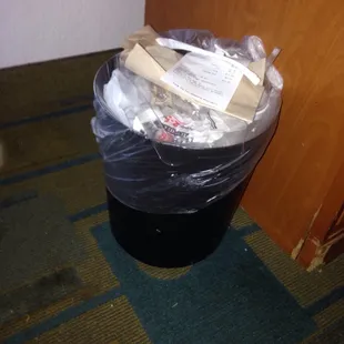 My garbage after two days of no service to my room. Should've had the young lady who made my bed take the garbage with her.