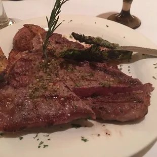 16 oz T-bone medium rare with asparagus and roasted red potatoes. Awesome!
