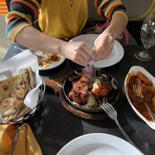 garlic naan, tandoori chicken, and the remnants of the idli stir fry