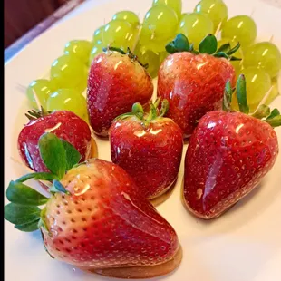 strawberries and grapes on a plate