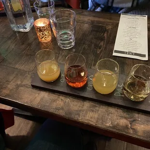 Mimosa flight. Champagne with apple, orange, cranberry and pineapple juice.