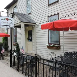 patio area with tables and umbrellas