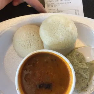 Sambar with Idli. A spicy soup with a cool tangy relish and rice cakes that taste like sour dough.  GF too.
