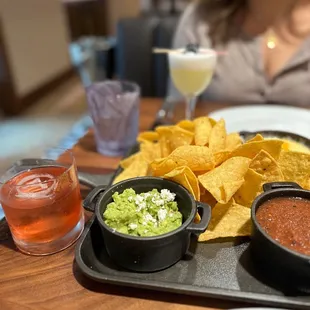Old Fashioned &amp; Blackberry Sour with Queso, Guac, Salsa &amp; Chips trio.