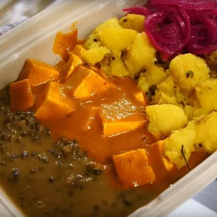 a person holding a container of food