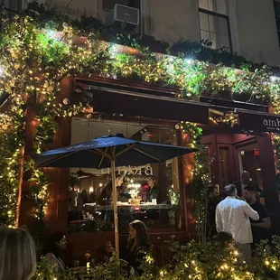 the outside of a restaurant decorated for christmas