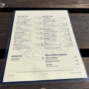 a menu on a park bench