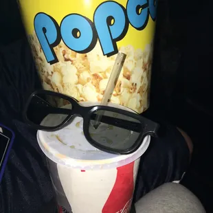 Batman vs Superman in 3D with a rootbeer and popcorn.
