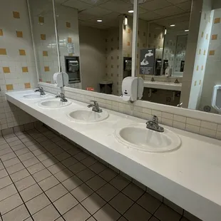 Clean counters in the bathroom. No paper on floor or splashes anywhere.