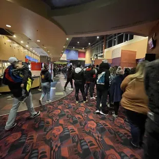 Line of 200 people at snack bar.