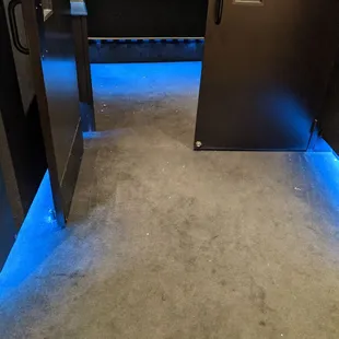 Popcorn all over the floor, entering the auditorium.