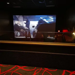 A plastic/glass partition?  Ruins the whole movie experience.